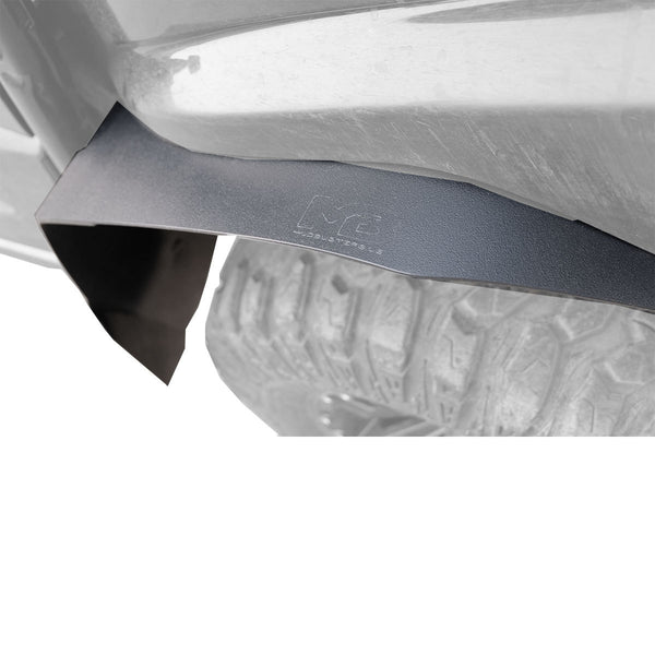 Top down look of the rear fender flare with super max covrage installed to show the coverage over the tire. The logo is shown clearly.