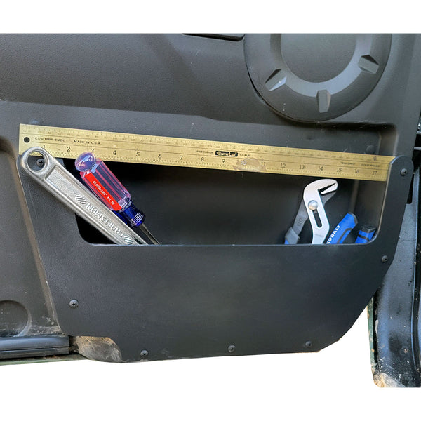 Yamaha Wolverine RMAX Driver side interior door pocket showing additional storage as it is filled with tools.   Ruller across the top  shows 18 inch width. 